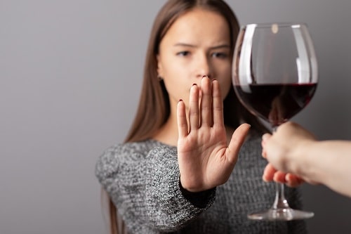 Woman Refusing Glass of Wine iStock Yana Tikhonova