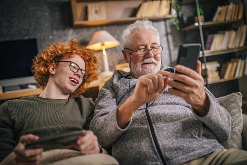 Old Person Young Person Phone Istock 1453321380 Zeljkosantrac