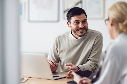 Man and woman talking and smiling iStock miniseries