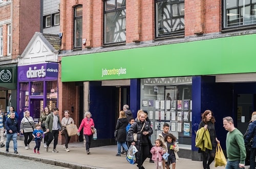 People Walking Past Job Centre iStock